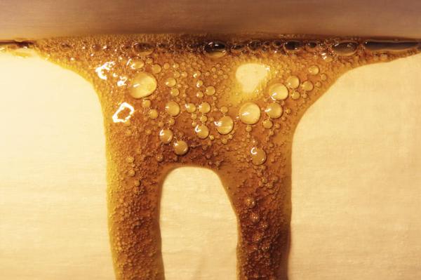 freshly pressed cannabis rosin oozing out on paper